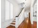Bright hallway with staircase and beautiful hardwood floors at 315 Oakwood Ave, Raleigh, NC 27601