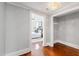 Hallway with an entry to the bedroom, hardwood floors, and a decorative light fixture at 315 Oakwood Ave, Raleigh, NC 27601