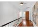 Upstairs hallway with hardwood floors and access to bedrooms and bathrooms at 315 Oakwood Ave, Raleigh, NC 27601