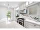 Charming kitchen boasts stainless steel appliances, elegant finishes, and abundant natural light at 315 Oakwood Ave, Raleigh, NC 27601