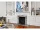Living room with a fireplace, custom built-ins and hardwood floors at 315 Oakwood Ave, Raleigh, NC 27601