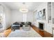 Spacious living room with fireplace, built-in shelving, and a view to the yard at 315 Oakwood Ave, Raleigh, NC 27601