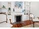 Elegant living room showcasing a fireplace, beautiful mantle, built in shelving, and hardwood floors at 315 Oakwood Ave, Raleigh, NC 27601