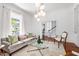 Cozy living room features an elegant couch, decorative pillows, area rug, and plenty of natural light at 315 Oakwood Ave, Raleigh, NC 27601
