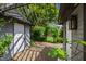 Enchanting garden path leading between outbuildings, surrounded by lush greenery and natural beauty at 315 Oakwood Ave, Raleigh, NC 27601