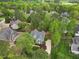 Aerial view of a home nestled among mature trees and landscaping in a quiet, established neighborhood at 341 Heather Bluffs Dr, Garner, NC 27529