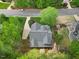 Aerial view of a charming home with a well-maintained yard and lush trees in a quiet neighborhood at 341 Heather Bluffs Dr, Garner, NC 27529
