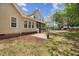 Inviting backyard with patio, manicured lawn, and a glimpse of the home's exterior at 341 Heather Bluffs Dr, Garner, NC 27529
