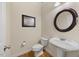 Half bathroom features a pedestal sink, toilet and neutral paint scheme at 341 Heather Bluffs Dr, Garner, NC 27529