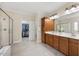 The primary bathroom features a double vanity, a glass enclosed shower, and walk-in closet at 341 Heather Bluffs Dr, Garner, NC 27529