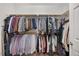 Walk-in closet offers ample storage space for clothes with dual rods and built-in shelving at 341 Heather Bluffs Dr, Garner, NC 27529