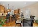 Charming dining area with a glass table, hardwood floors, and access to kitchen at 341 Heather Bluffs Dr, Garner, NC 27529
