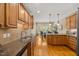 Spacious kitchen with granite countertops, hardwood floors, and ample cabinet space at 341 Heather Bluffs Dr, Garner, NC 27529