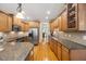 Well-equipped kitchen with granite countertops, stainless steel appliances, and tiled backsplash at 341 Heather Bluffs Dr, Garner, NC 27529