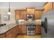 Well-equipped kitchen featuring stainless steel appliances and granite countertops at 341 Heather Bluffs Dr, Garner, NC 27529