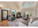 Inviting living room with fireplace, vaulted ceilings, large windows and comfortable seating at 341 Heather Bluffs Dr, Garner, NC 27529