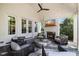 Cozy covered back porch with a fireplace, comfortable seating, and ample space for entertaining at 3513 Bellevue Rd, Raleigh, NC 27609