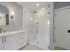Modern bathroom featuring a glass shower, white vanity, and tile floors at 3513 Bellevue Rd, Raleigh, NC 27609