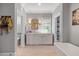 Bright bathroom with white vanity, toilet room, and shelving at 3513 Bellevue Rd, Raleigh, NC 27609
