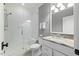 Bathroom features white vanity, granite countertop, toilet, and glass-enclosed shower at 3513 Bellevue Rd, Raleigh, NC 27609
