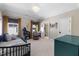Cozy bedroom with a daybed, built-in shelving, and a view to a bath at 3513 Bellevue Rd, Raleigh, NC 27609