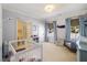 Charming bedroom with bright wallpaper, ample natural light, and soothing blue accents at 3513 Bellevue Rd, Raleigh, NC 27609