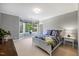 Bright bedroom features a large bay window, carpeted floors, and a comfy bed at 3513 Bellevue Rd, Raleigh, NC 27609