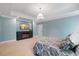 Comfortable bedroom featuring plush carpet, neutral walls, and a stylish tray ceiling at 3513 Bellevue Rd, Raleigh, NC 27609