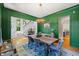 Formal dining room with hardwood floors, stairs, and stylish chandelier at 3513 Bellevue Rd, Raleigh, NC 27609