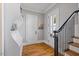 Charming entryway features hardwood floors, white shelving, and natural light at 3513 Bellevue Rd, Raleigh, NC 27609