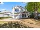Well-kept two-story home with an attached garage, large driveway, and inviting front porch at 3513 Bellevue Rd, Raleigh, NC 27609