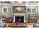 Bright living room featuring a fireplace, hardwood floors, and decorative accents at 3513 Bellevue Rd, Raleigh, NC 27609