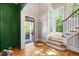 Grand foyer with hardwood floors, stairs, and view to the front door and front yard at 3513 Bellevue Rd, Raleigh, NC 27609