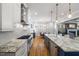 Bright kitchen with white cabinets, granite countertops, stainless appliances, and an eat-in breakfast nook at 3513 Bellevue Rd, Raleigh, NC 27609