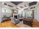 Inviting living room with coffered ceilings, hardwood floors, fireplace and stylish decor at 3513 Bellevue Rd, Raleigh, NC 27609