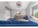 Large living room with a cozy sofa, window seat, modern decor, and plenty of natural light at 3513 Bellevue Rd, Raleigh, NC 27609