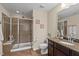 Bathroom featuring a glass shower, modern fixtures, and neutral colors at 36 Argonaut Dr, Durham, NC 27705