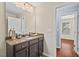 Bathroom with granite countertops, and modern fixtures, leading to the primary bedroom at 36 Argonaut Dr, Durham, NC 27705