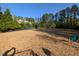 Community dog park with wood chip ground cover and dog toys at 36 Argonaut Dr, Durham, NC 27705