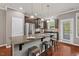 Modern kitchen with a spacious island, stainless steel appliances, and outdoor access at 36 Argonaut Dr, Durham, NC 27705