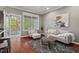 Cozy living area featuring a stylish sitting area, neutral-toned sofa, and an outdoor patio at 36 Argonaut Dr, Durham, NC 27705