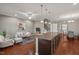 Bright living area featuring a modern kitchen island with seating, open to the comfortable living area at 36 Argonaut Dr, Durham, NC 27705