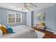 Serene main bedroom showcasing a ceiling fan, natural light, and a cozy decor at 36 Argonaut Dr, Durham, NC 27705