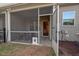 View of the screened in patio showing the access to the house and the backyard at 36 Argonaut Dr, Durham, NC 27705