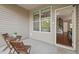 View of patio furniture and doorway to the house on the screened in patio at 36 Argonaut Dr, Durham, NC 27705