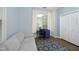 Inviting bedroom featuring a cozy sofa, a desk, and a large window for plenty of natural light at 409 Courthouse Dr, Morrisville, NC 27560