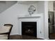 A cozy fireplace with a white mantel, perfect for relaxing evenings at 409 Courthouse Dr, Morrisville, NC 27560