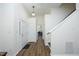 Bright foyer with hardwood floors, neutral walls, and a staircase leading to the upper level at 409 Courthouse Dr, Morrisville, NC 27560