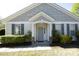 Inviting home exterior with a gray front door, sidelight windows, and gray shutters at 409 Courthouse Dr, Morrisville, NC 27560