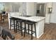 Open kitchen with stainless steel appliances and a breakfast bar, ideal for casual dining and entertaining at 409 Courthouse Dr, Morrisville, NC 27560